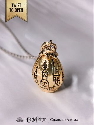 Charmed Aroma Candle and Golden Egg Pendant